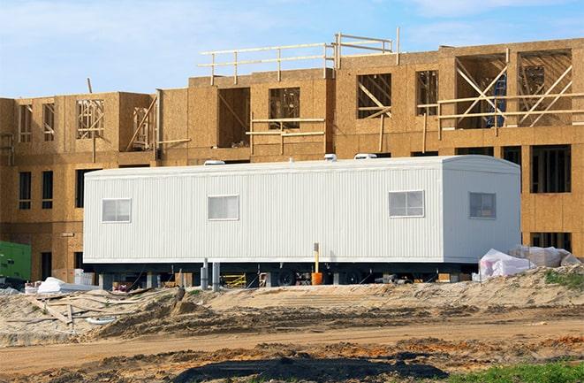 construction workers discussing plans in a rental office in Fallbrook, CA